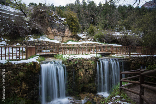 Waterfalls of Fonts del Cardener, next to the town of La Coma, in Lleida, with traces of snow from the last snowfall