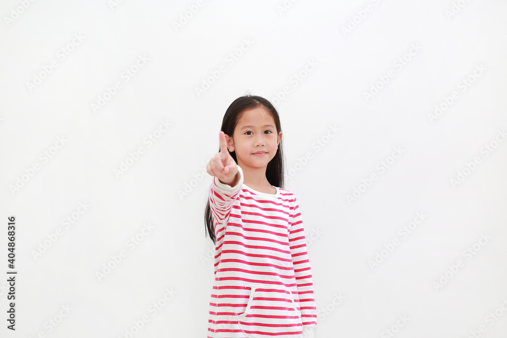 Portrait Asian little girl point index finger pressing an imaginary button isolated on white background with copy space Portrait Asian little girl point index finger pressing an imaginary button isolated on white background with copy space