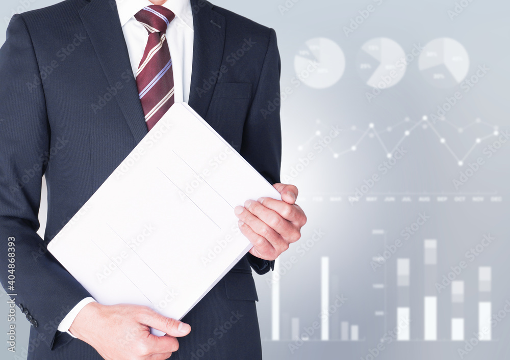 ファイルを抱えるビジネスマンとグラフ背景