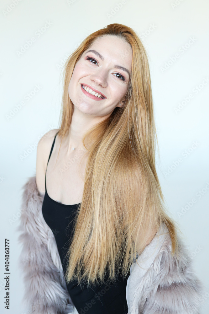 Portrait of a young woman in an eco fur coat Portrait of a young woman in an eco fur coat