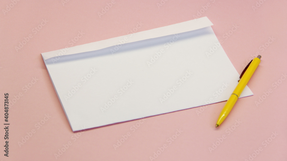 clean white envelope with yellow handle on light background clean white envelope with yellow handle on light background
