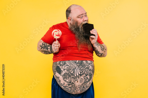 Man eating a chocolate tablet. photo