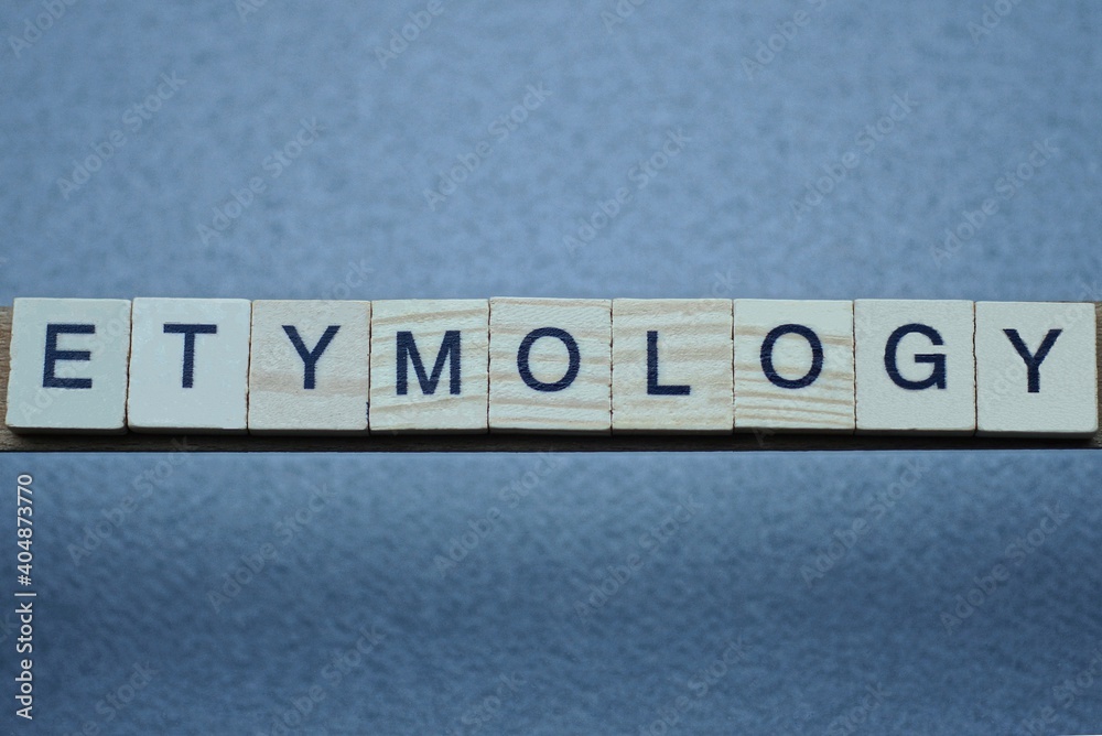 Ταπετσαρία text the word etymology from brown wooden small letters with black font on an gr