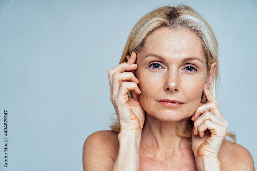 Beautiful senior woman posing on a beauty photo session. Beautiful senior woman posing on a beauty photo session.