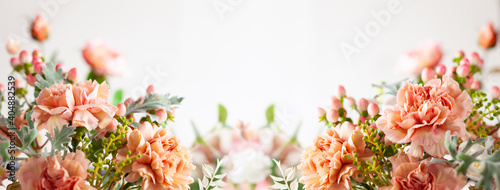 Autumn composition made of beautiful flowers on light backdrop. Floristic decoration. Natural floral background.