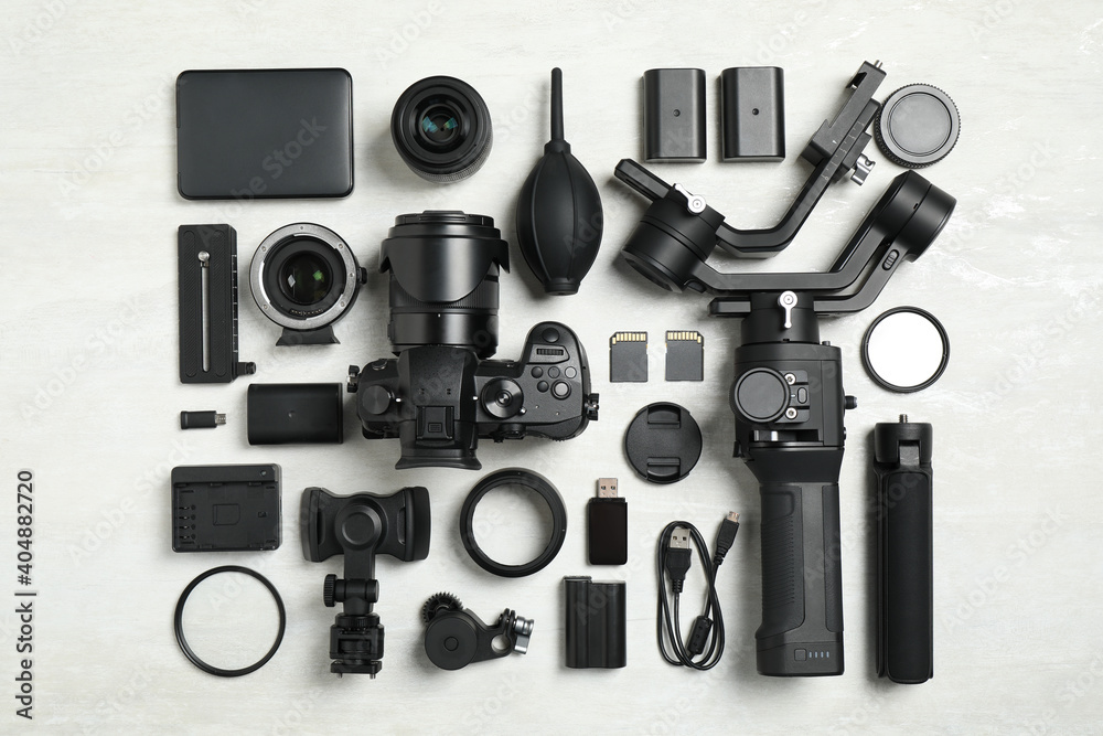 Flat lay composition with camera and video production equipment on light background Flat lay composition with camera and video production equipment on light background