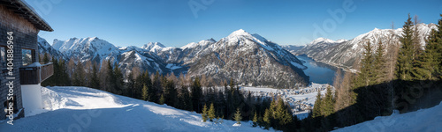 panoramic view from Zwolferkopf mountain to lake achensee and tirolean alps in winter