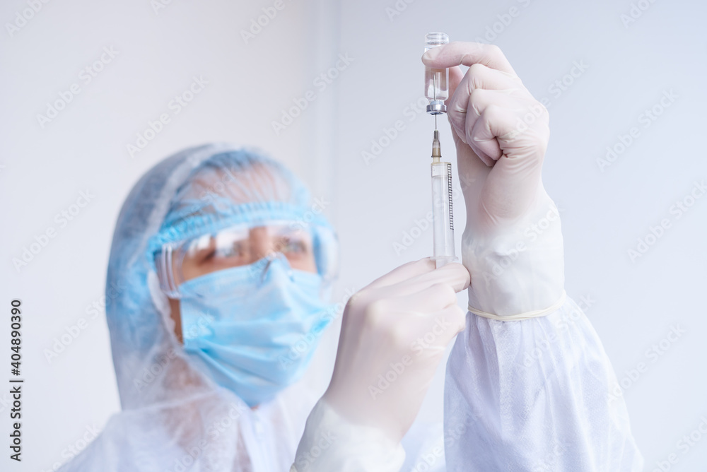 Syringe and drug in the hands of a doctor. Syringe and drug in the hands of a doctor.