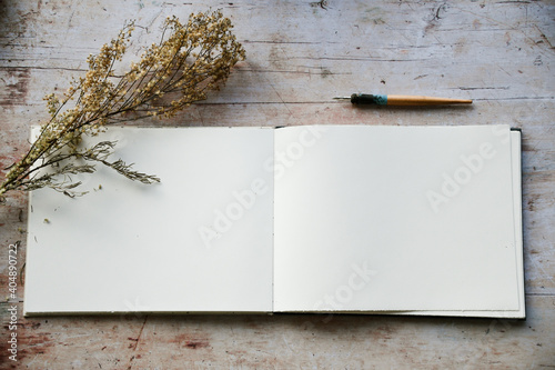 Blank journal open for creative writing or journaling art activities photo