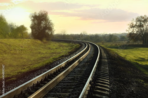 Railway line in countryside on sunny day. Train journey