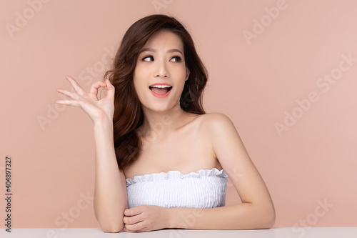 Beautiful asian woman long hair smile with clean and fresh skin happiness and cheerful with positive emotional, Facial treatment, Beauty and cosmetics concept.