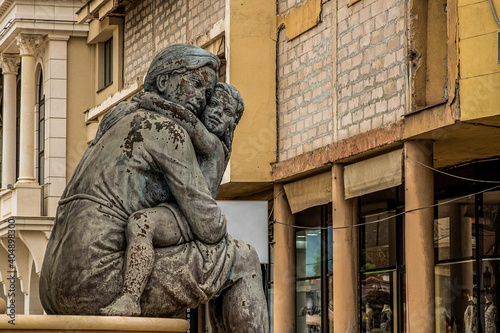Skopje / North Macedonia, May 12 2019: Fountain of the Mothers of Macedonia. Sculpture of a mother with braids holding her child. The statue is representing Alexander the Great and his mother