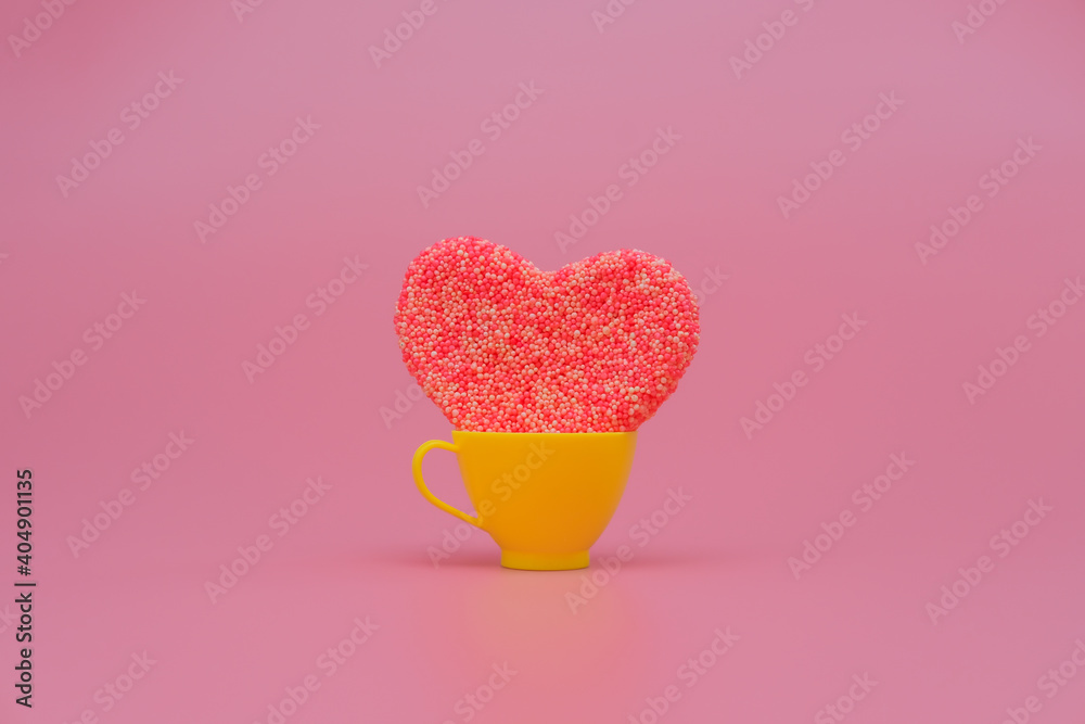 Heart in a toy cup on pink background. Love, wedding and Valentine's day celebration concept. Copy space Heart in a toy cup on pink background. Love, wedding and Valentine's day celebration concept. Copy space