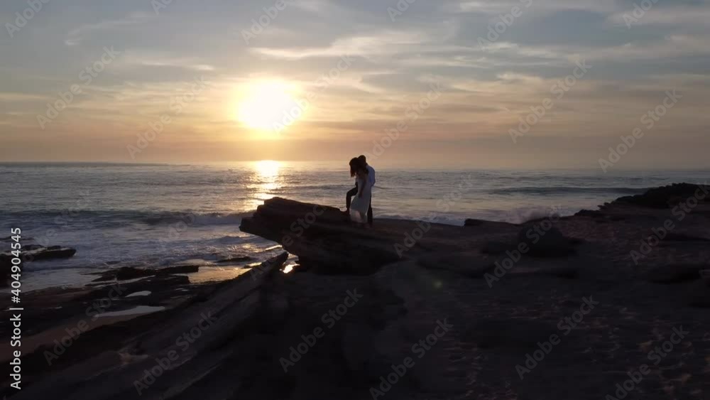 Loving bride and groom on seashore at sunset Loving bride and groom on seashore at sunset