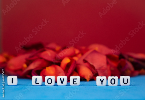 I love you against the background of rose petals . Valentine's Day. Background concept of love and beauty