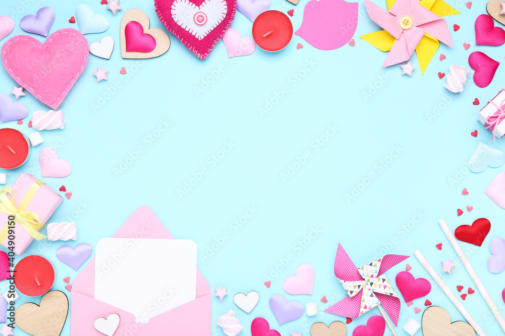 Valentine hearts with marshmallows, gift boxes and paper windmills on blue background