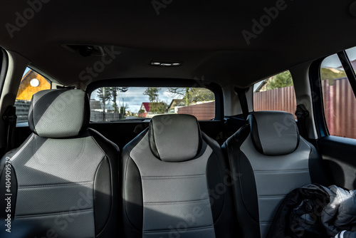 Back passenger seats in modern car. © Natallia
