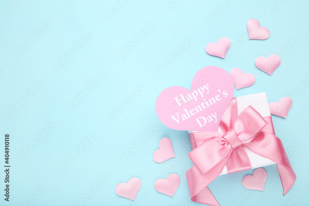 Gift box and heart with text Happy Valentines Day on blue background