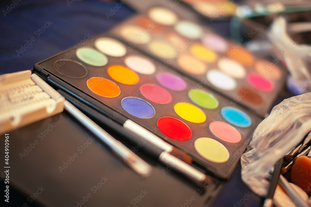 Make up palette and brushes. Focus concept. Make up palette and brushes. Focus concept.