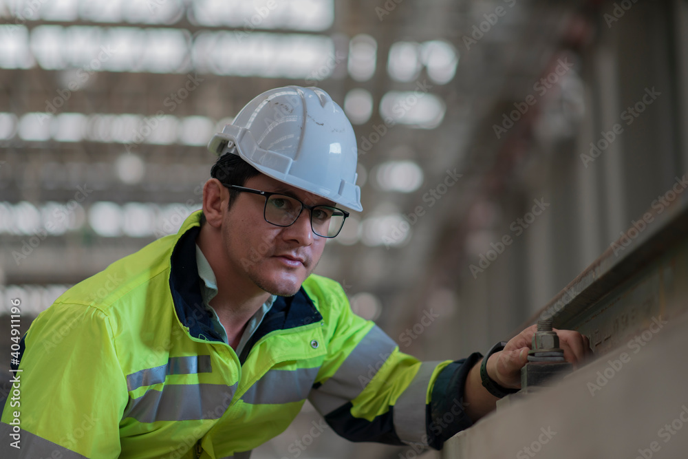 Obraz premium engineer Sitting in depot and inspection railway . construction worker on railways. Engineer work on railway. rail, engineer, Infrastructure