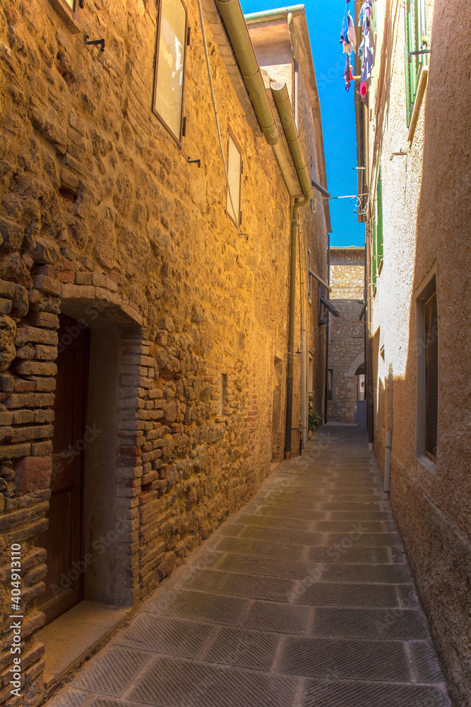 A quiet residential street in the historic medieval village of Batignano, Grosseto Province, Tuscany, Italy
