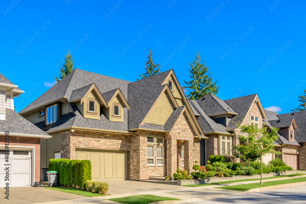 Houses in suburb at Summer in the north America. Luxury houses with nice landscape.