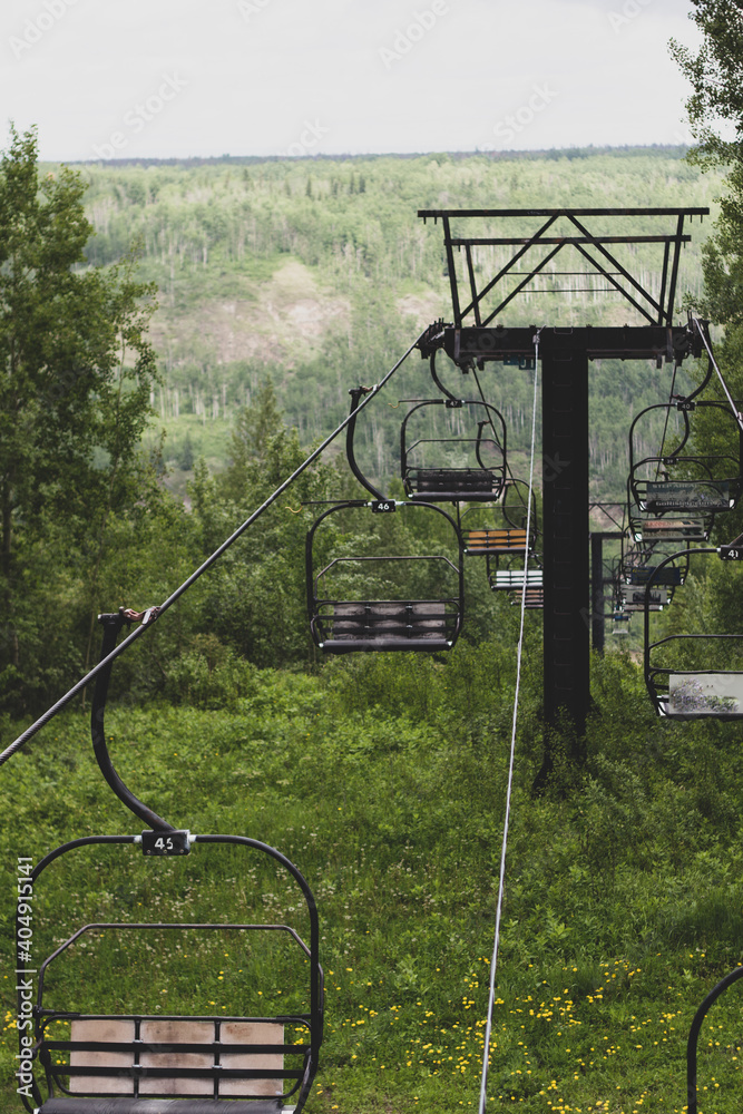 Ski lift in summer time view downhill. Ski lift in summer time view downhill.