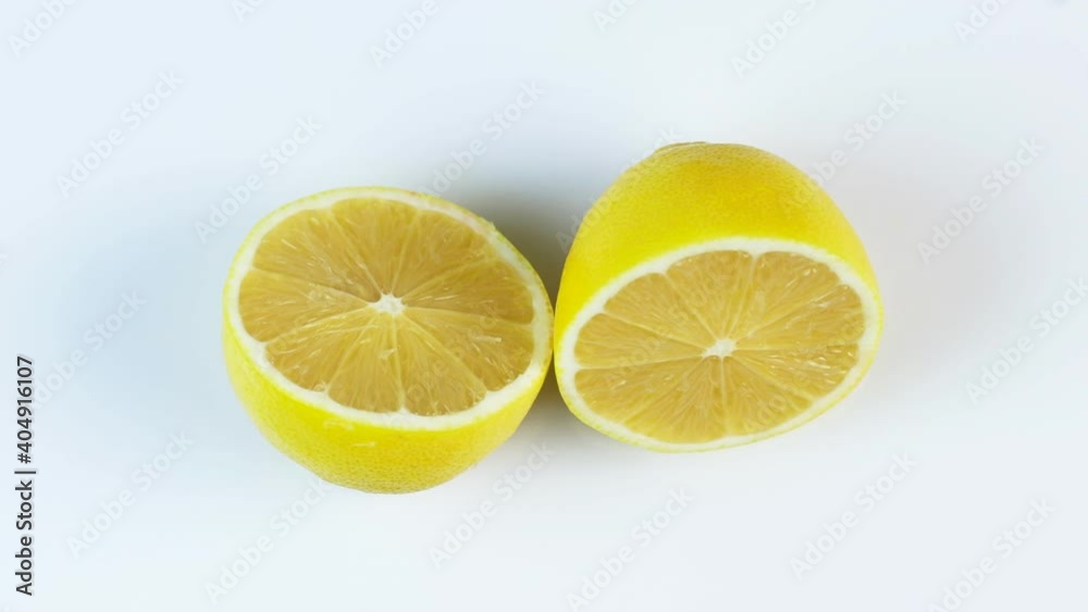 Fresh lemons rotating in a circle, white background, and space for text. Fresh lemons rotating in a circle, white background, and space for text.