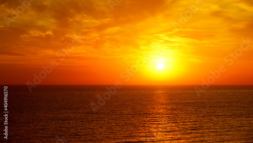 Fantastic ocean and sunset sky in red colors.