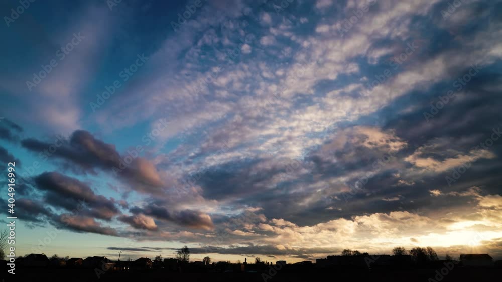 Time lapse of strong movement from the wind of dark clouds across the sky on a cloudy day. Sunset, in the evening. Time lapse of strong movement from the wind of dark clouds across the sky on a cloudy day. Sunset, in the evening.