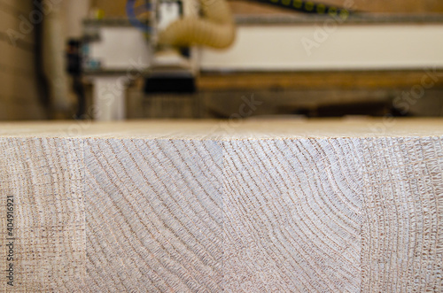 Close-up of stacked lumber for construction, background. On the background of a cnc machine