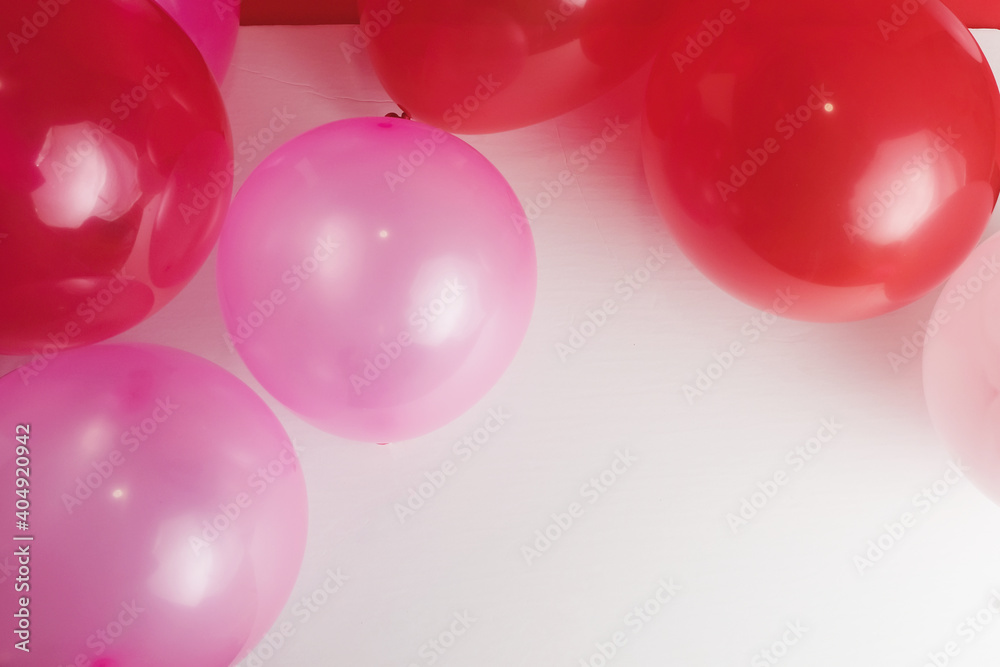 Pink and red party balloons for Valentine's Day celebration.
