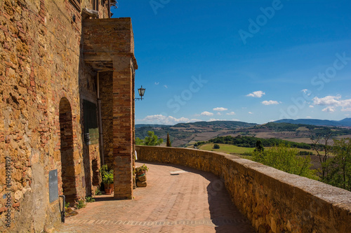 A building on the historic city walls of the village of Pienza in Siena Province, Tuscany, Italy
