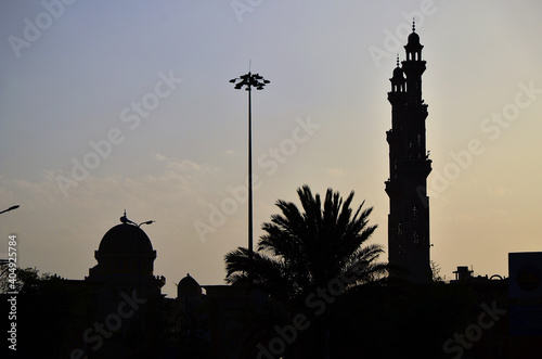 Dark silhouette of the mosque against the background of the evening sky