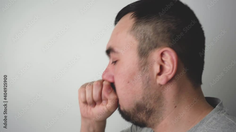 Adult bearded man coughing on white background Adult bearded man coughing on white background