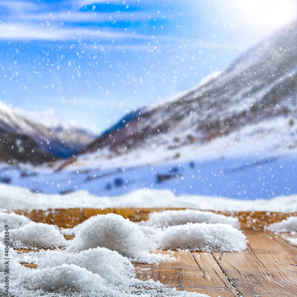 Wooden old table covered with snow against the background of a beautiful winter landscape in picturesque unusual places.