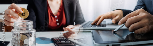 Digital marketing media in virtual screen.businesswoman hand working with mobile phone and modern compute with VR icon diagram at office in morning light