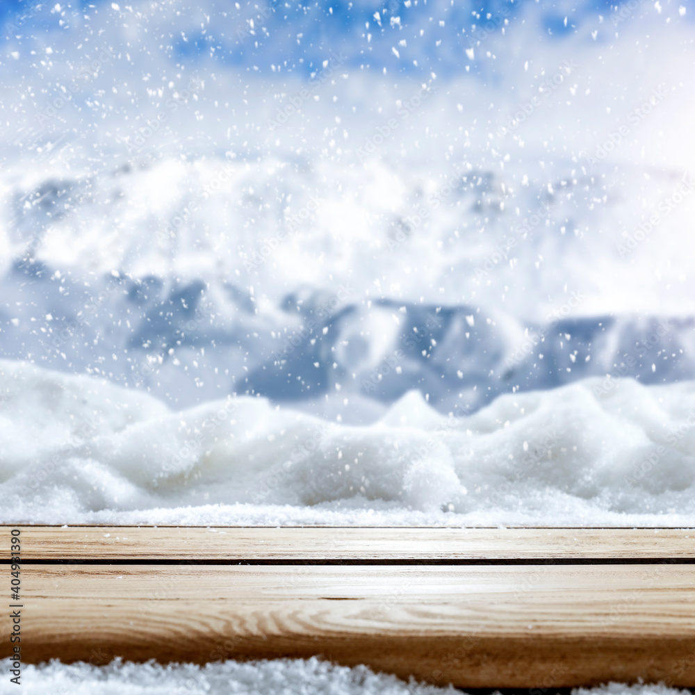 Wooden old table covered with snow against the background of a beautiful winter landscape in picturesque unusual places.