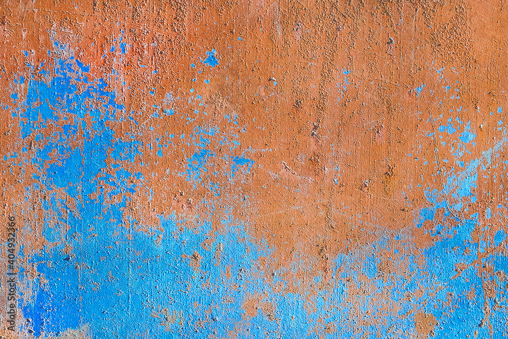 Old rusty metal texture with peeling blue paint from surface background