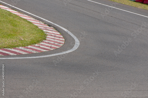sleek asphalt and danger at the bend of the motorbike track, motoGP © Monika Zell