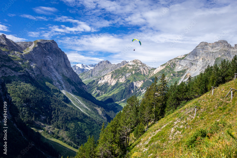 Paragliding over the pralognan mountains in the Vanoise National Park