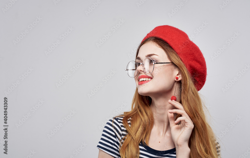 happy woman in a red beret having fun on a light background close-up Copy Space happy woman in a red beret having fun on a light background close-up Copy Space