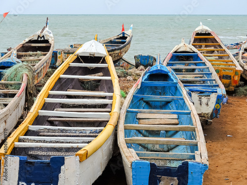 cayucos on the African coast of Senegal prepared to carry migrants photo