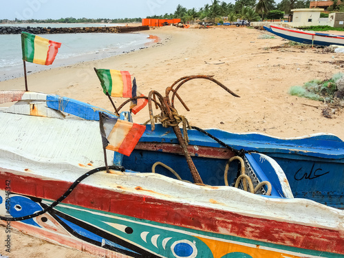 cayucos on the African coast of Senegal prepared to carry migrants photo