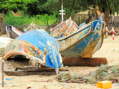 cayucos on the African coast of Senegal prepared to carry migrants photo