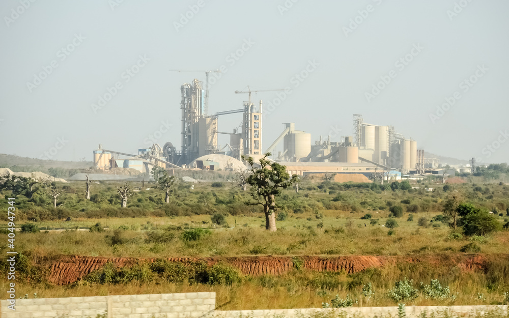 cement factory next to a baobab forest