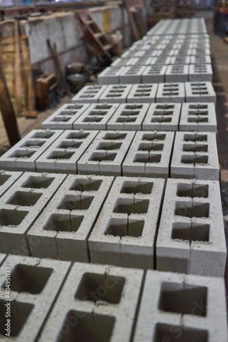 Industrial production of building materials from pressed cement mortar. High quality hollow concrete block or cement brick. © Ryzhkov Oleksandr