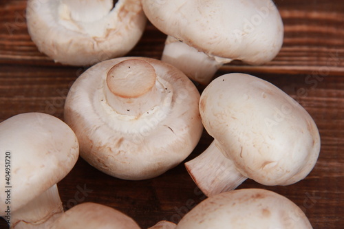fresh champignons close-up on a wooden table Vegetarian food. Proper nutrition