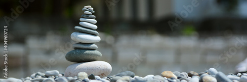 a stone tower stands on the beach in color