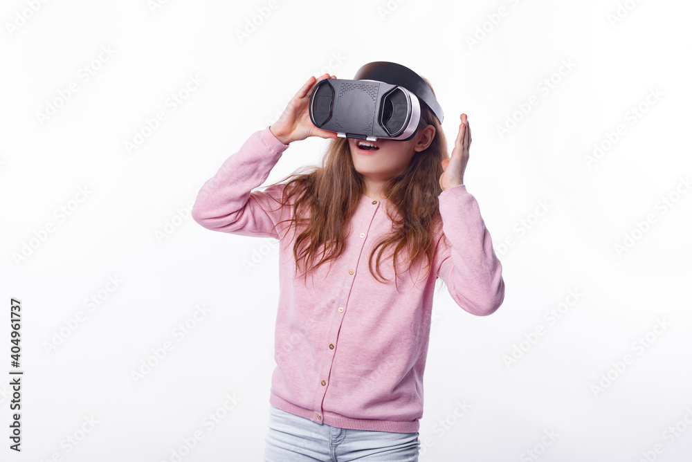 Photo of little girl having Virtual reality experience over white background. Photo of little girl having Virtual reality experience over white background.